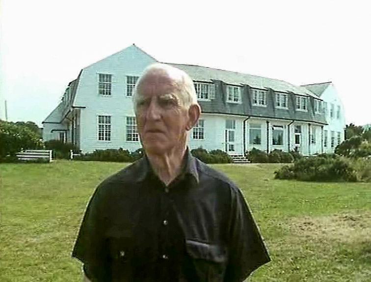 Ray Davey, Founder of the Corrymeela Community, outside the old Corrymeela House, Ballycastle. (1989)