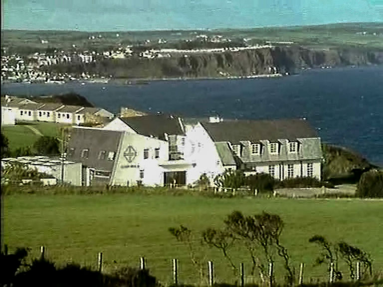 The old Corrymeela complex as it was in the 1980's, with Ballycastle village in the background.